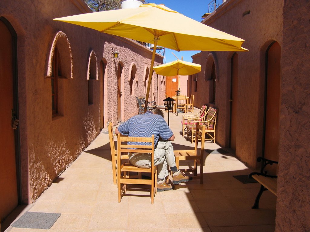 10-Writing postcard on the courtyard of our hotel.jpg - Writing postcard on the courtyard of our hotel